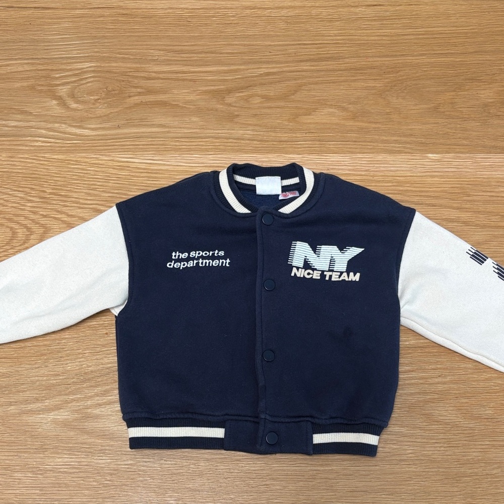 Cute varsity jacket. 

Navy and white